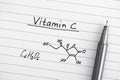 Chemical formula of Vitamin C with pen. Royalty Free Stock Photo