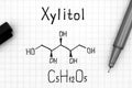 Chemical formula of Xylitol with pen