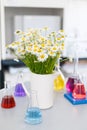 Chemical laboratory flask with blue purple-pink liquid stand on the table Royalty Free Stock Photo