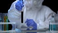 Chemical laboratory researcher examining test tube with naphtha, fuel quality Royalty Free Stock Photo