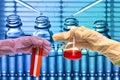 Chemical Laboratory,scientist dropping the reagent into test flask Royalty Free Stock Photo