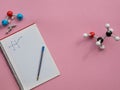 Chemical molecular models in representation of some organic molecules with lewis representation of ethanol on a notebook. Chemistr