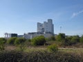 Chemical plant behind wild shrubbery