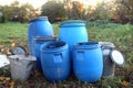 The blue plastic barrels for storage of chemicals . Stockpile of used blue plastic drums for storing water and other liquids Royalty Free Stock Photo