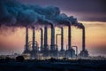 Chemical plant smokestacks emit toxic haze, towering ominously into sky Royalty Free Stock Photo