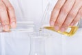 Chemical reagent pouring and mixing, Laboratory and science experiments, Oil formulating the chemical for medical Royalty Free Stock Photo