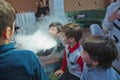 Chemical show for kids. Professor carried out chemical experiments with liquid nitrogen on Birthday little boy . The child was