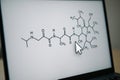 Chemical structure of a complex molecule displayed on a laptop for research Royalty Free Stock Photo
