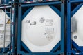 Chemical tank container. ISO tank container for chemical delivery. Bulk liquid transport. Chemical company. Container freight area
