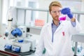 Chemical technician checking liquid reagent