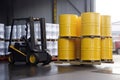 chemicals being transported in barrels, with forklift and truck visible Royalty Free Stock Photo