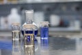 Chemicals in a science laboratory. Glass vials containing chemicals for analytical chemistry