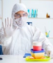 Chemist checking and testing plastic dishes