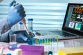 Chemist engineer working in laboratory with pipette and flask Royalty Free Stock Photo