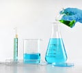 Scientist with equipment and science experiments, Laboratory glassware containing toxic chemical liquid. Royalty Free Stock Photo