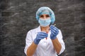 Chemist holding flask with liquid substance on abstract background Royalty Free Stock Photo