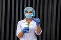 Chemist holding flask with liquid substance on abstract background Royalty Free Stock Photo