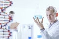 Chemist holding vessel with substance Royalty Free Stock Photo