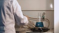 Chemist in laboratory holding test tube during the reaction - metal iron chemical test