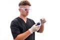 Chemist in laboratory with test tube examining it isolated on white background Royalty Free Stock Photo