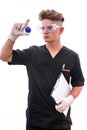 Chemist in laboratory with test tube examining it isolated on white background Royalty Free Stock Photo
