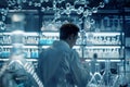 Chemist with molecular structures blending into a hightech pharmaceutical lab Royalty Free Stock Photo
