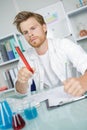 Chemist observing the chemical Royalty Free Stock Photo