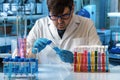 Researcher engineer working with test tube in the research laboratory Royalty Free Stock Photo