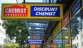 Chemist Warehouse sign above the entrance to the drug store on Oxford Street.