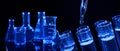 Collage of different laboratory glassware with liquids on black background Royalty Free Stock Photo