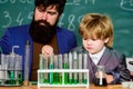 Chemistry experiment. Teacher child test tubes. Cognitive process. Kids cognitive development. Mental process acquiring
