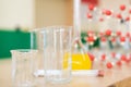 Chemistry glassware with liquid formula and molecular structure model at the science classroom laboratory. Royalty Free Stock Photo