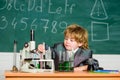 Chemistry lab. Back to school. Little kid learning chemistry in school laboratory. kid in lab coat learning chemistry