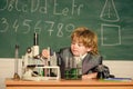 chemistry lab. Back to school. Little kid learning chemistry in school laboratory. kid in lab coat learning chemistry