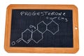 School slate on which is written the chemical formula of progesterone