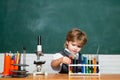 Chemistry lesson. School chemistry lessons. First grade. Little children at school lesson. Education. Back to school and Royalty Free Stock Photo