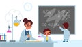 Chemistry lesson. Students in classroom interior with teacher, boy writes formulas on school blackboard, girl with flask Royalty Free Stock Photo