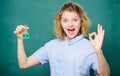 Chemistry lesson. Woman teacher performing experiment with bulb and liquid. Chemistry lab. Interesting and fascinating Royalty Free Stock Photo