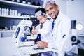 Chemistry, microscope and scientist with child in laboratory for medical research, science and education. Healthcare