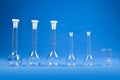 Chemistry science - flasks on blue background Royalty Free Stock Photo