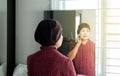 Chemotherapy concept,Senior asian woman with disease cancer standing and looking something in her bedroom,Elderly female feeling d