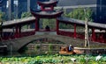 Chengdu, China: Covered Bridge and Boat at Long Tan Water Town Royalty Free Stock Photo