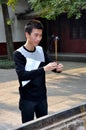 Chengdu, China: Man Praying with Incense Sticks