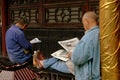 Chengdu, China: Men Reading Newspapers