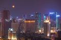 Chengdu downtown skyline at night with full moon Royalty Free Stock Photo