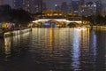 Illuminated bridge reflected in the river in Chengdu, China. Royalty Free Stock Photo