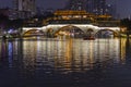 Illuminated bridge reflected in the river in Chengdu, China. Royalty Free Stock Photo