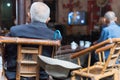 Senior chinese people watching TV in an old tearoom Royalty Free Stock Photo