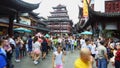 Chenghuangmiao street with travelers and pagoda style buildings