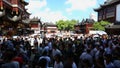 Chenghuangmiao street with travelers and pagoda style buildings